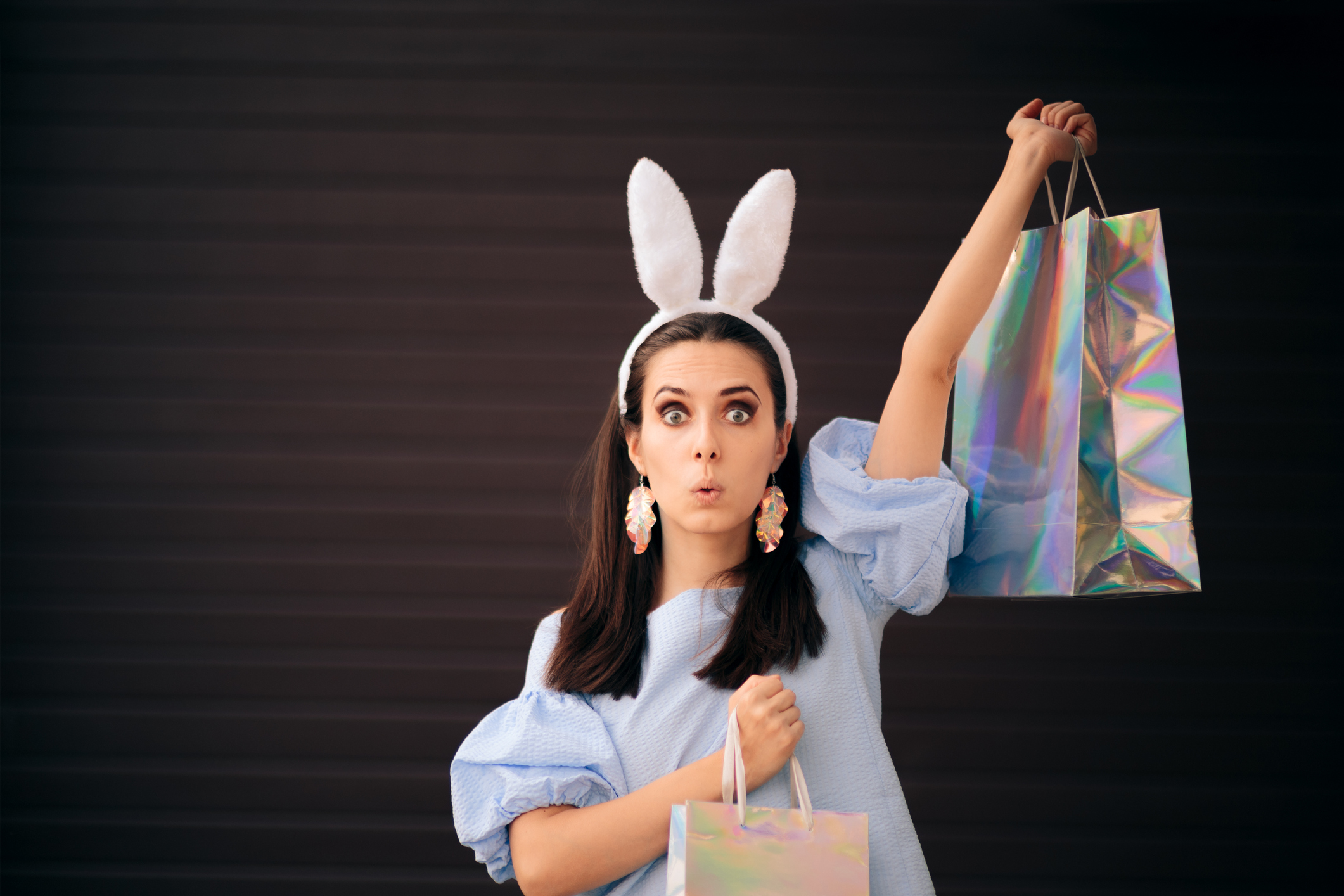 Woman with Easter Bunny Ears Holding Shopping Bags