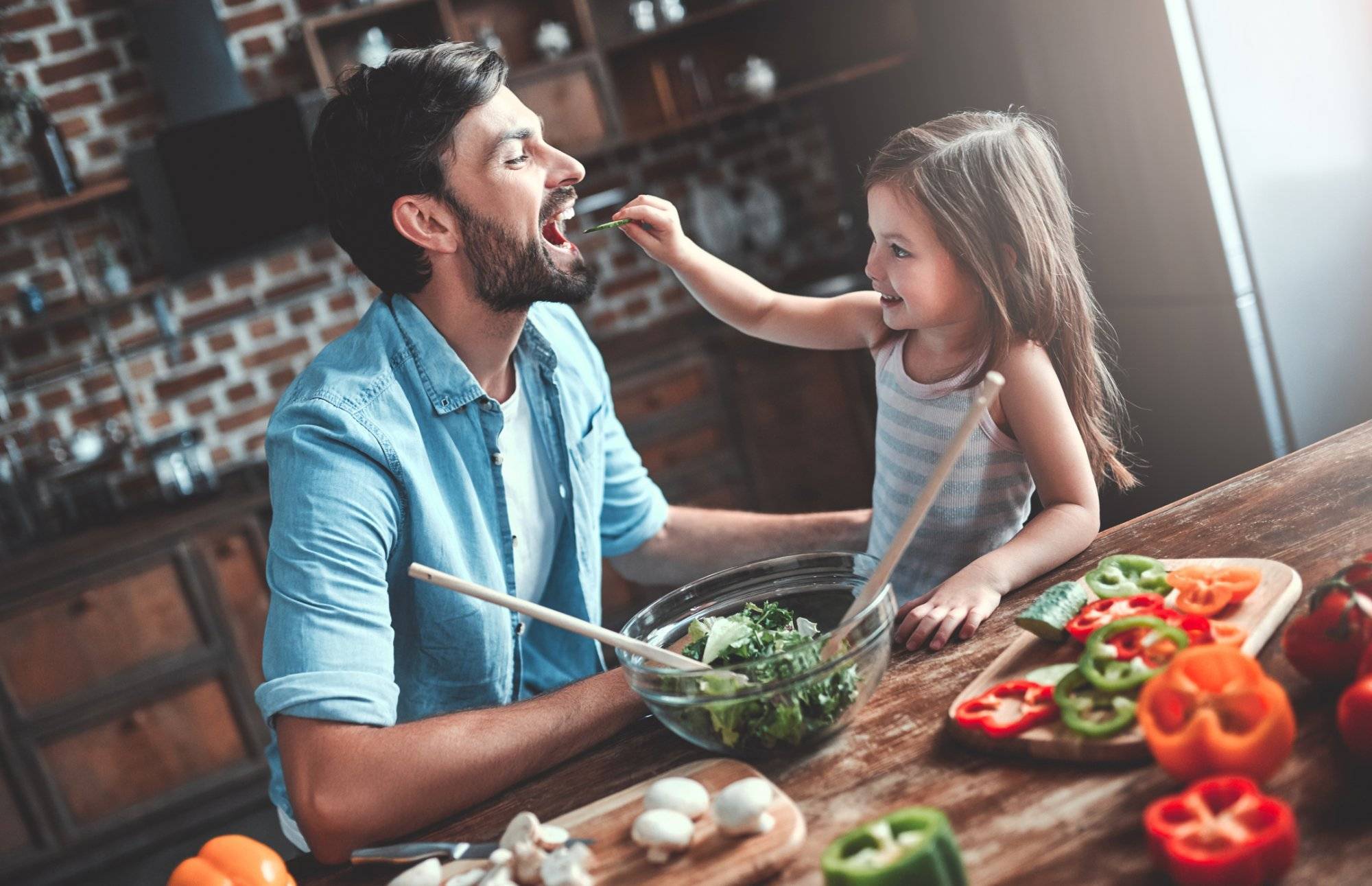 Dad with daughter on kitchen