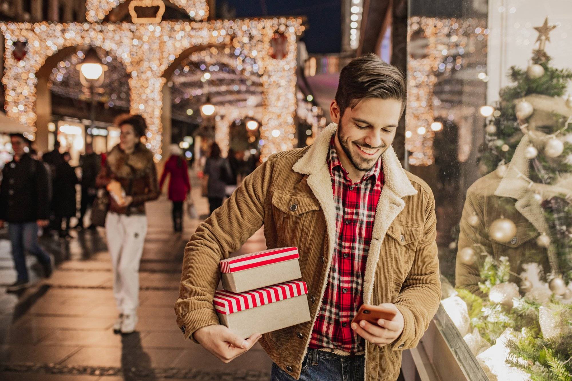 Young man in Christmas shopping